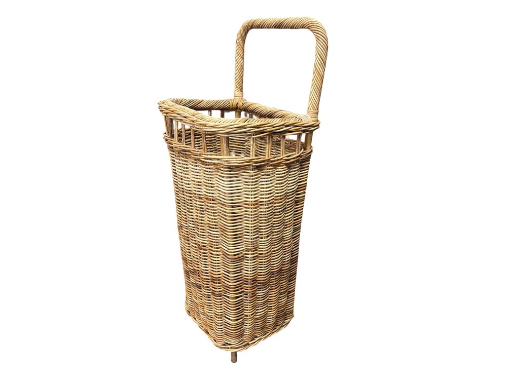 Kathy Kuo rattan rolling floor basket
