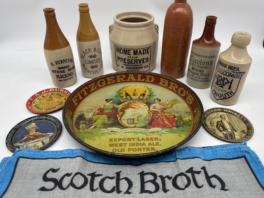 Stoneware beer bottles, crock, tin trays