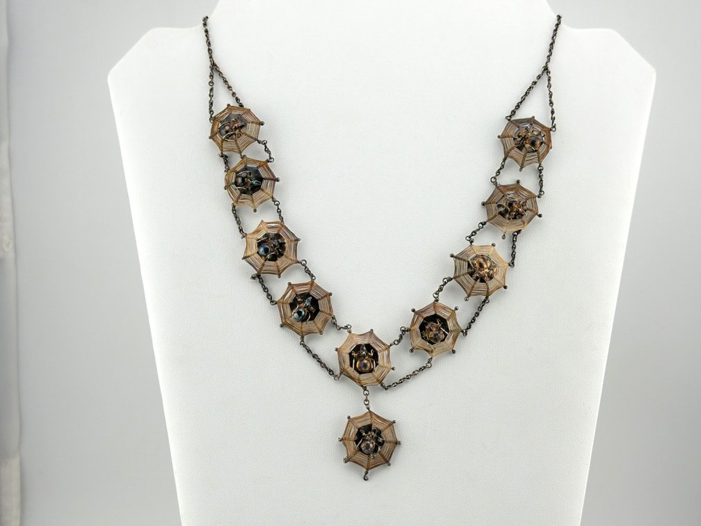 Low karat sterling spider web necklace