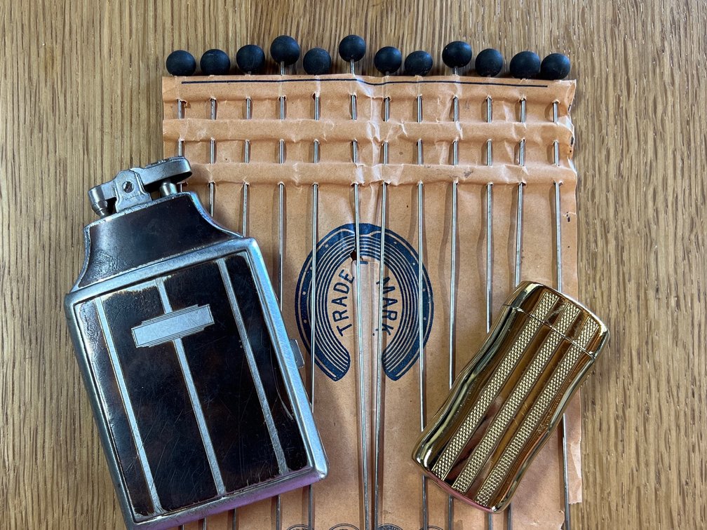 Vintage lighters and hat pins