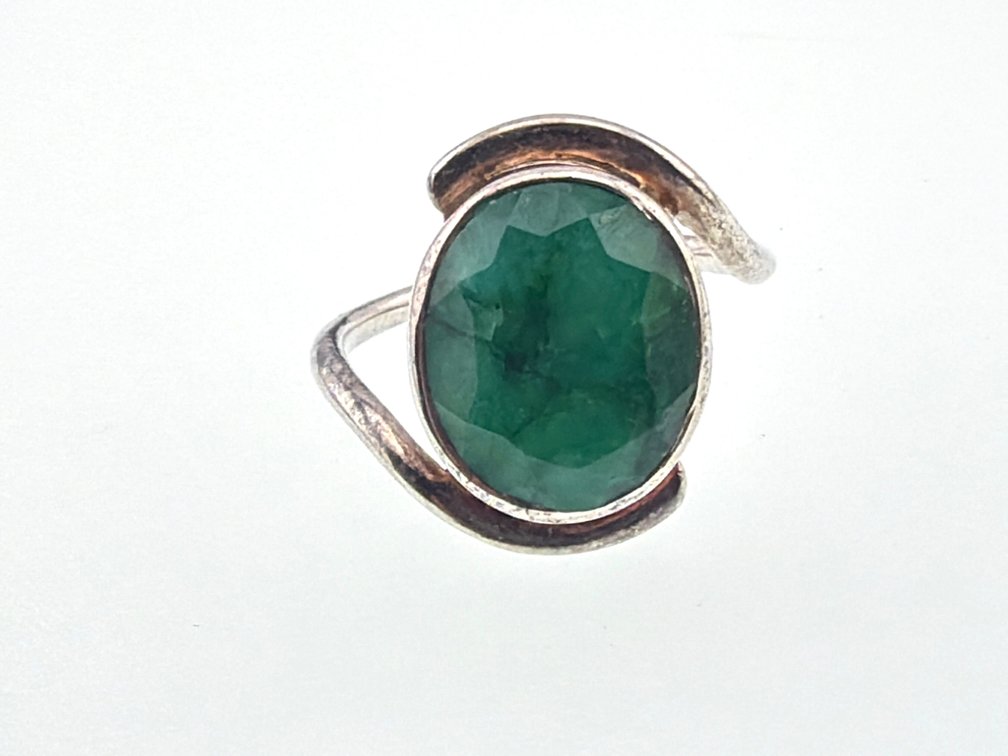 Sterling and oval emerald dinner ring; approx. 5 ctw.