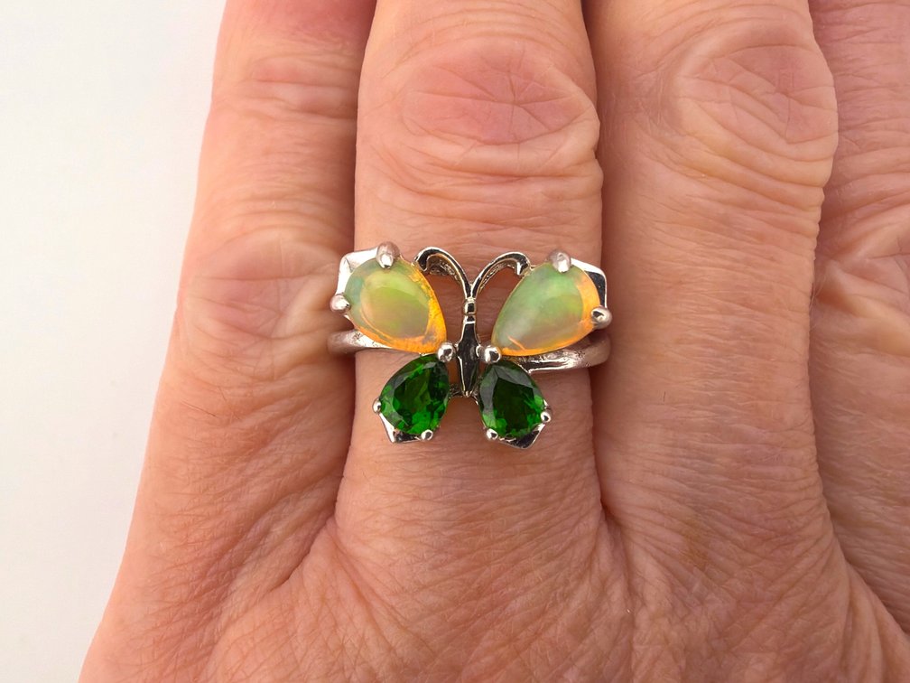 Sterling butterfly ring with opals and green garnets