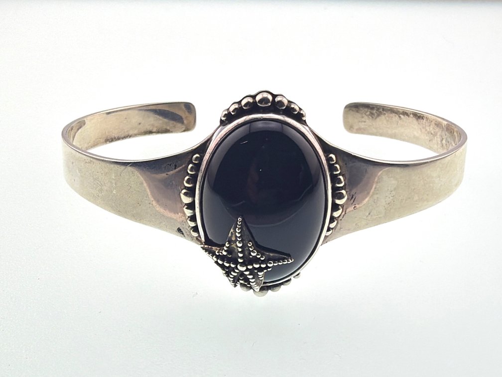 Sterling signed Sajen onyx cuff with starfish