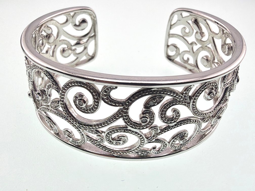 Sterling scroll work cuff with bezel set diamonds