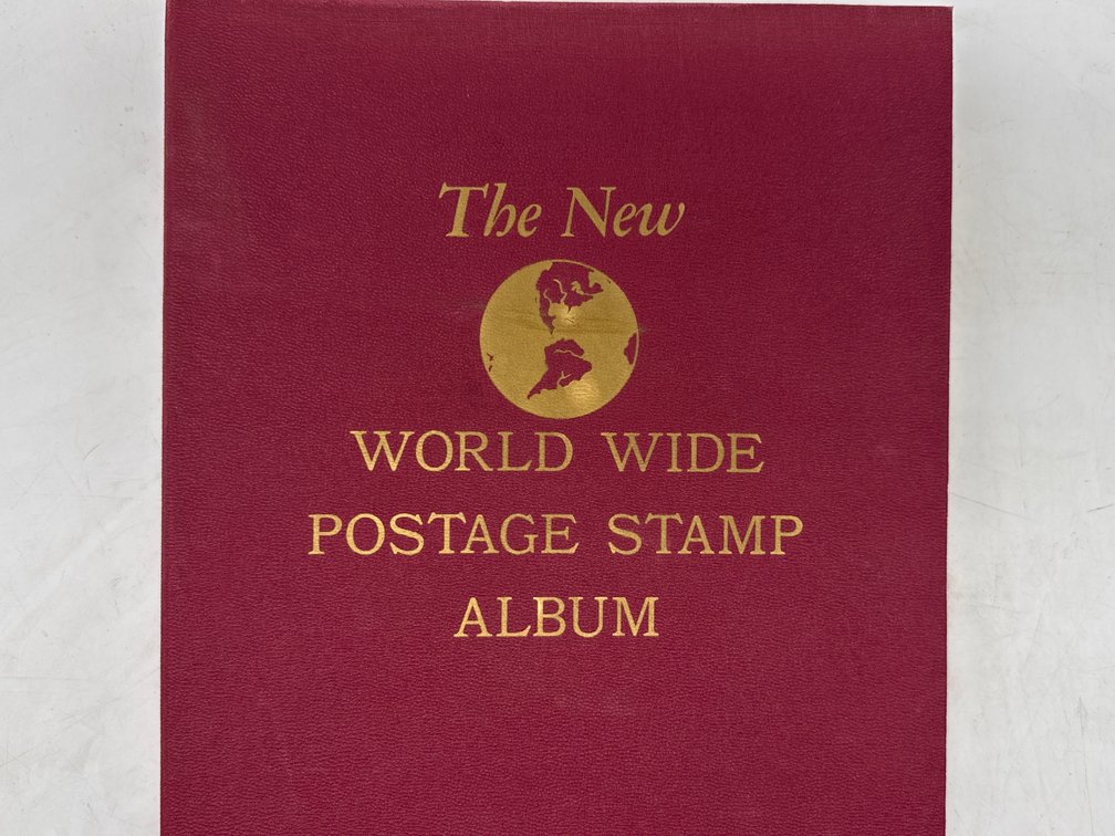 Partially filled World Wide Postage Stamp Album