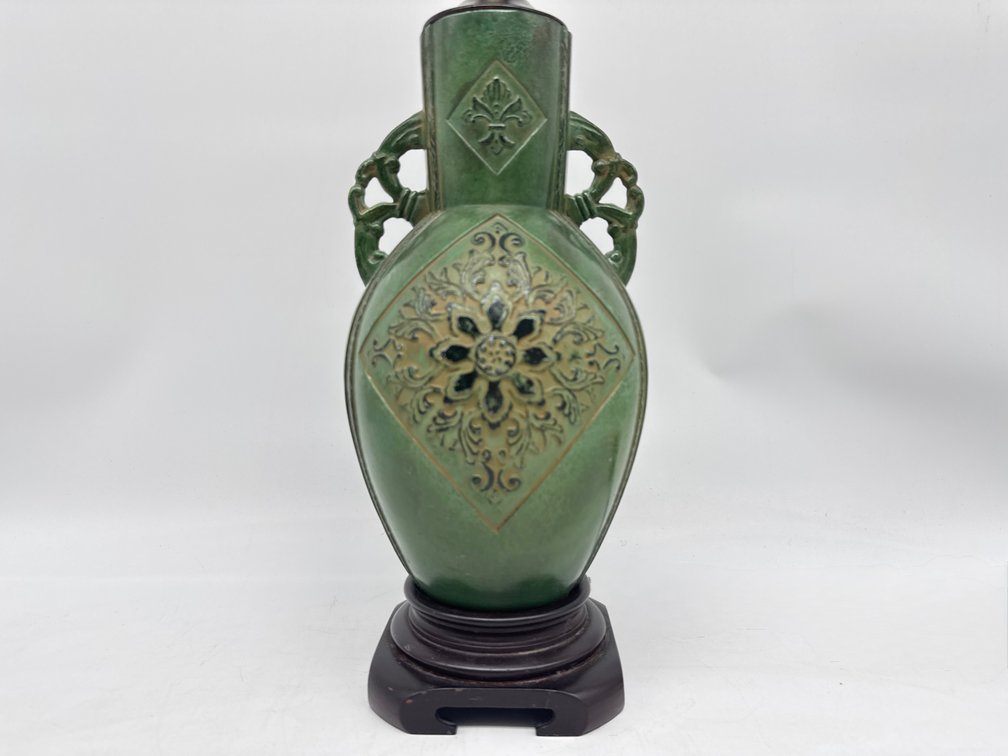 Raised relief metal table lamp with green surface and shade