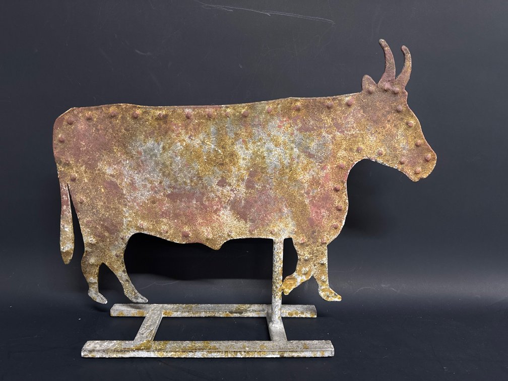 Folk art style stand of profile of a cow