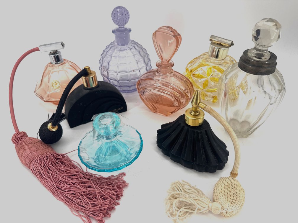 Collection of vintage perfume and vanity bottles
