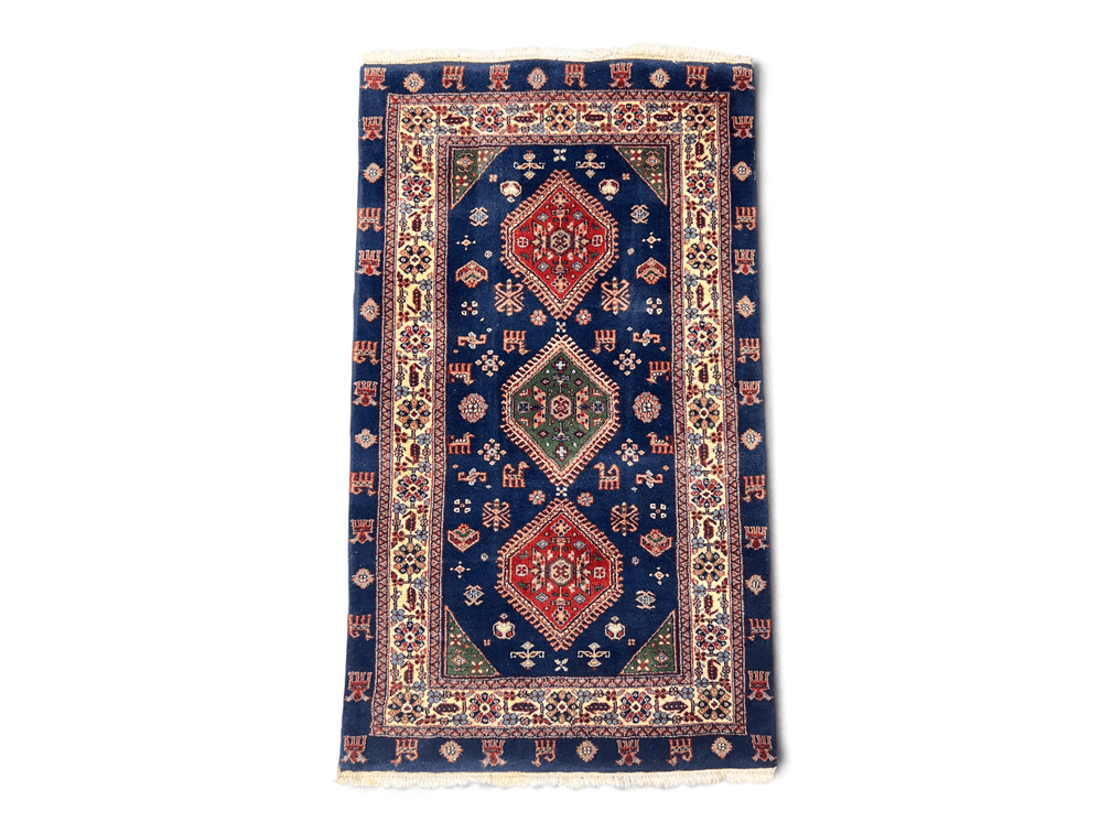 Wool tribal design Indian scatter rug; 65" x 36"