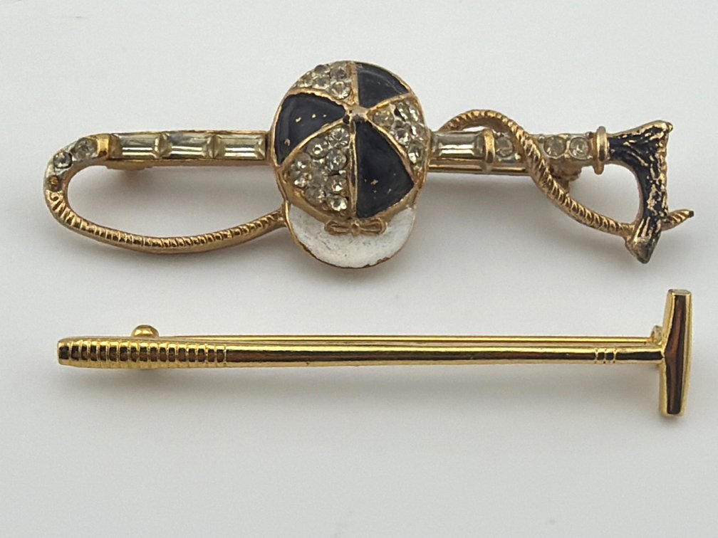 Two gold tone riding crop pins