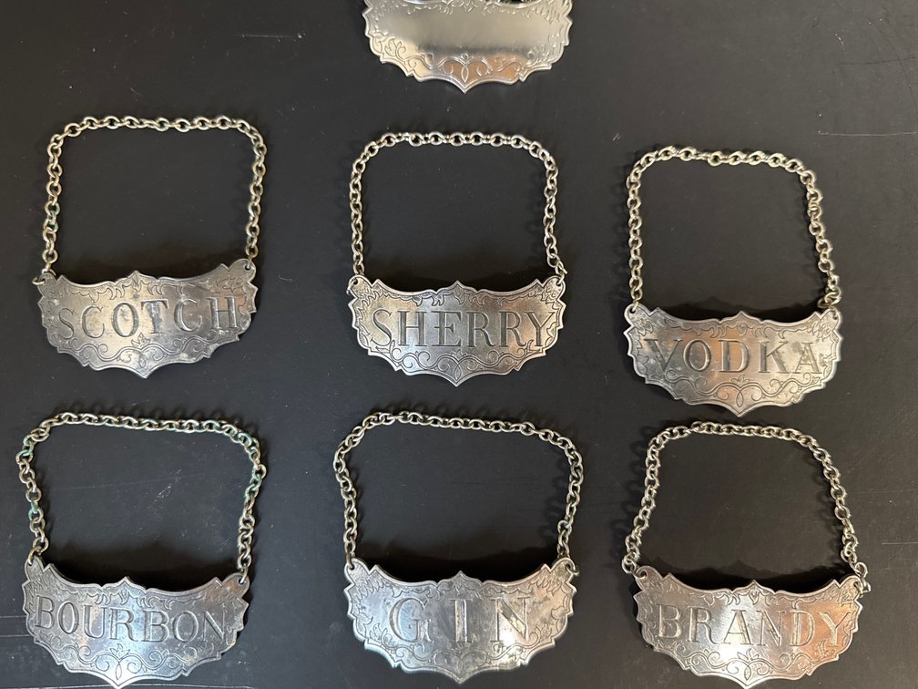 Set of unused Stieff pewter Historic Newport decanter labels (7)