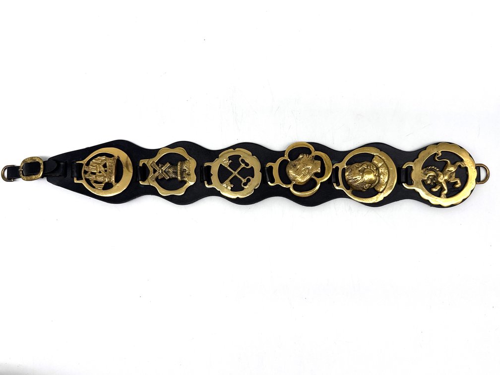 Equestrian brass medallions on leather strap