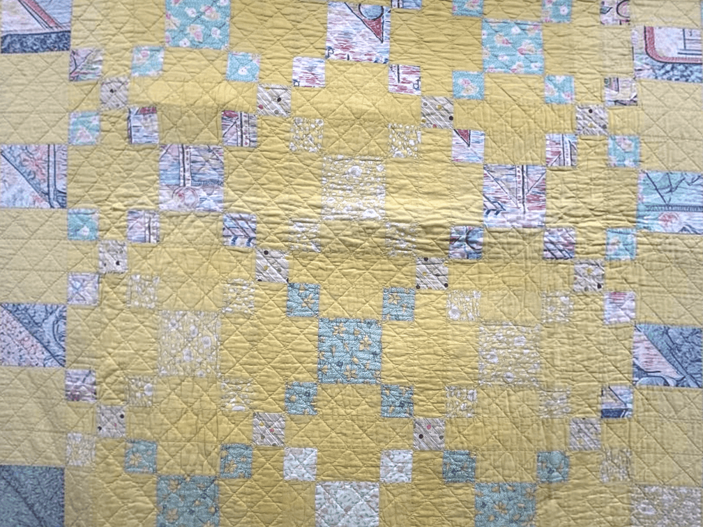 Vintage cotton handmade patchwork quilt in yellow