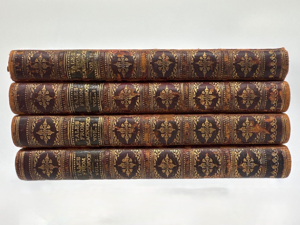 Four small leather bound books