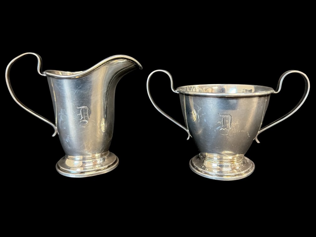 Two piece monogrammed sterling cream and open sugar "D"