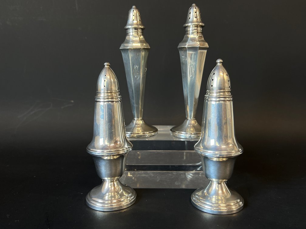Two pairs of sterling weighted salt and pepper shakers