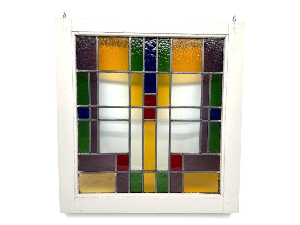 Framed stained glass window panel