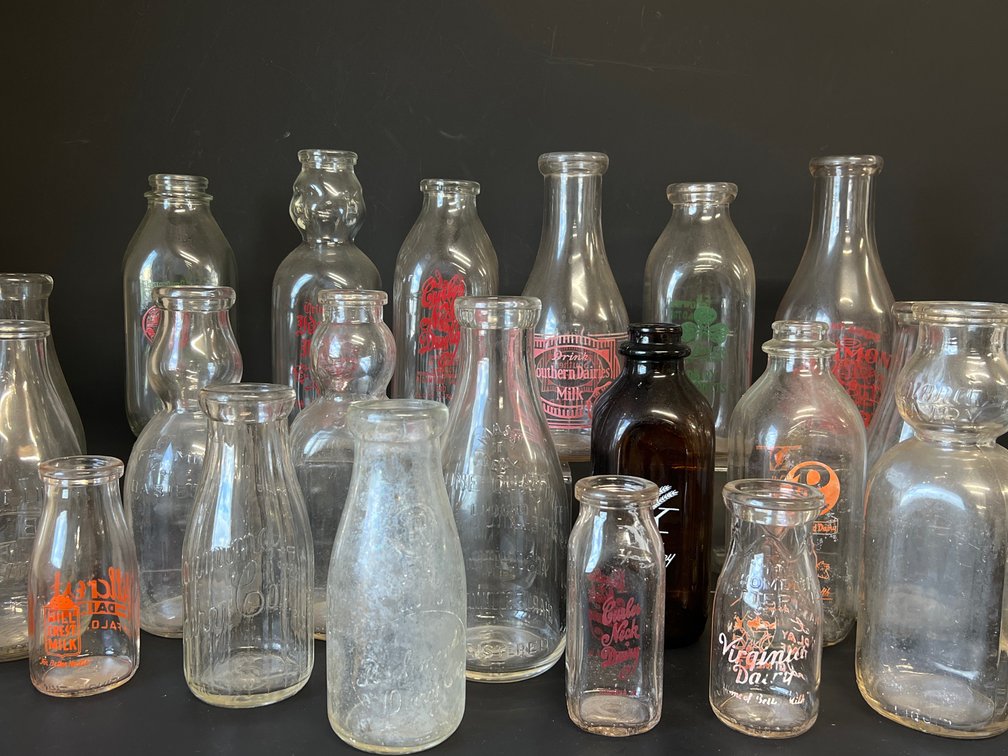 Large grouping of collectible vintage milk bottles, some from Richmond Dairy firms