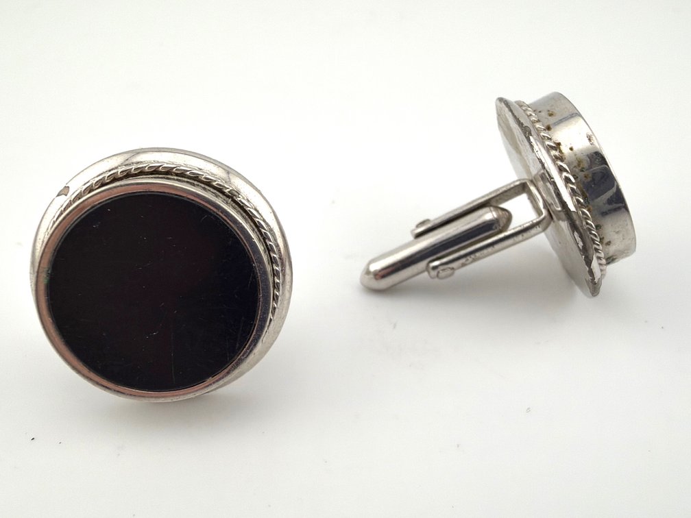 Good looking pair of men's SWANK silver tone and black cuff links