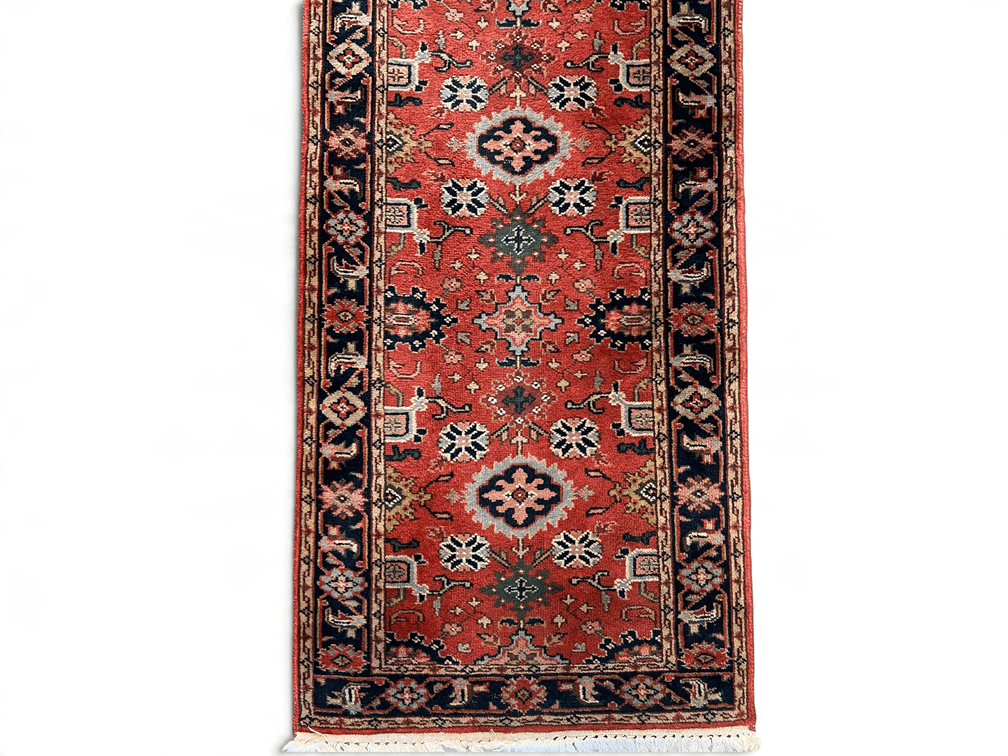 Indian wool runner with rust ground; 31” x 11’11”