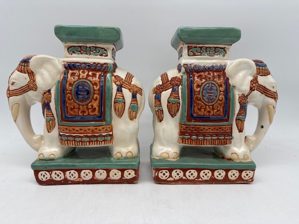 Painted ceramic elephant stands
