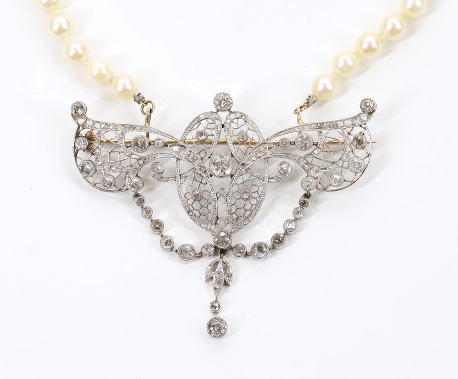 Diamond Enhancer Pin on Pearl Strand. 5.0CTW