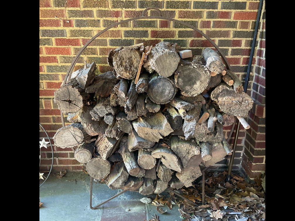 Firewood with Circular Metal Hoop Rack