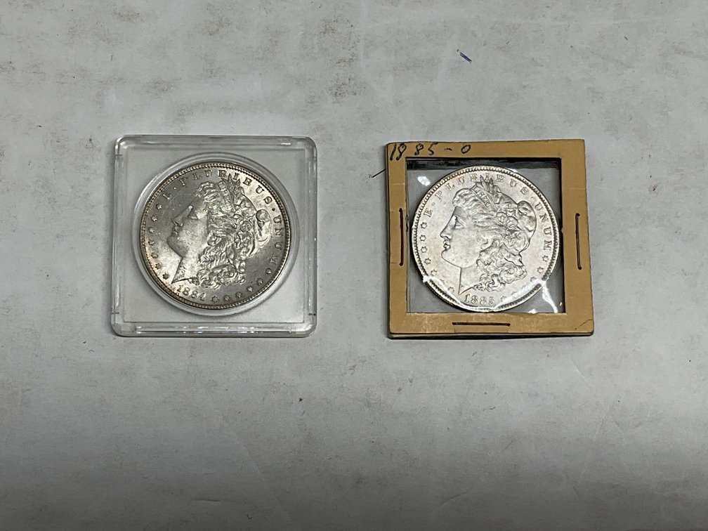 1884 and 1885-O US Morgan Silver Dollars