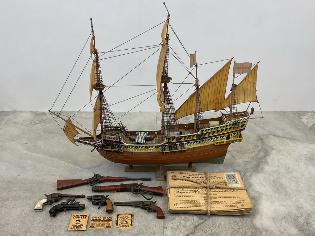 Model Galleon Ship, Toy Firearms, and War Ration Books