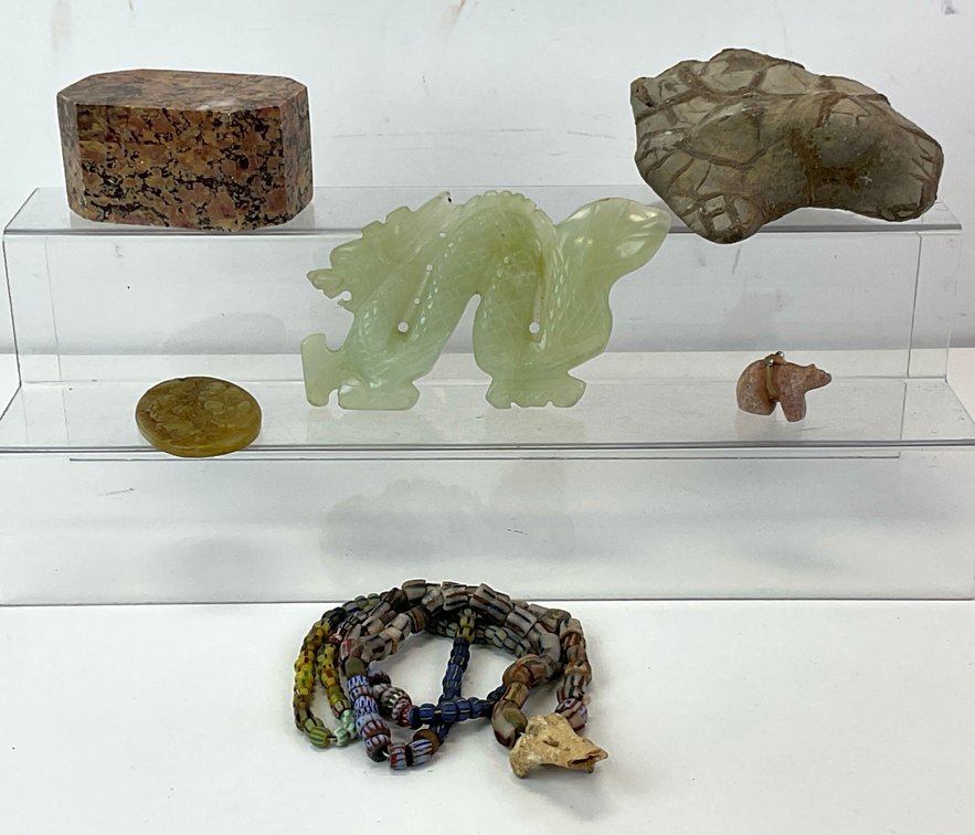 Carved Stone Pendants, Glass Trade Bead Necklace, and Stone Carvings