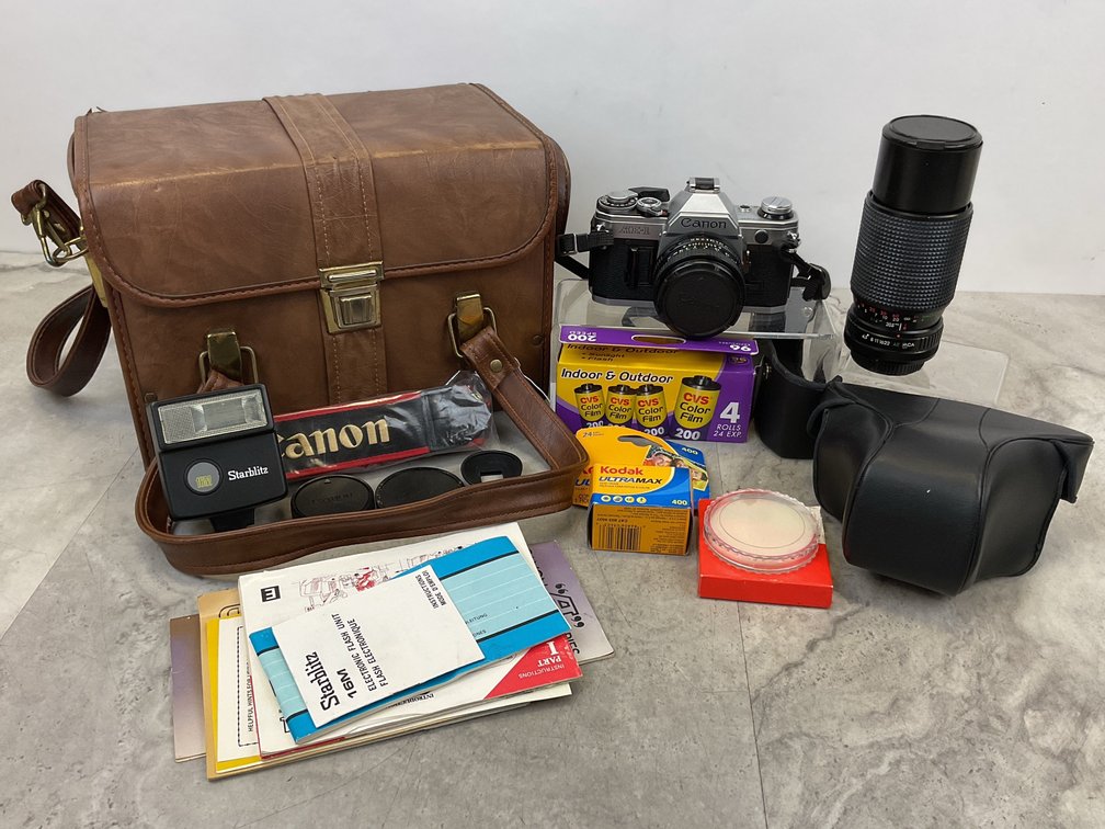 35mm SLR Camera, Zoom Lens, Flash, and Carrying Case