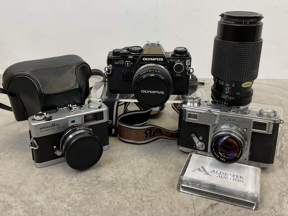 Olympus OM10, Minolta Hi-Matic 7sII, and Contax Cameras with Zoom Lens