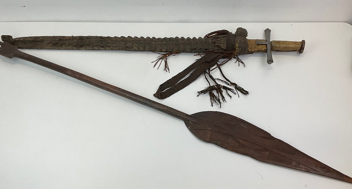 Sword with Reptile Hide Scabbard and Carved Wood Paddle