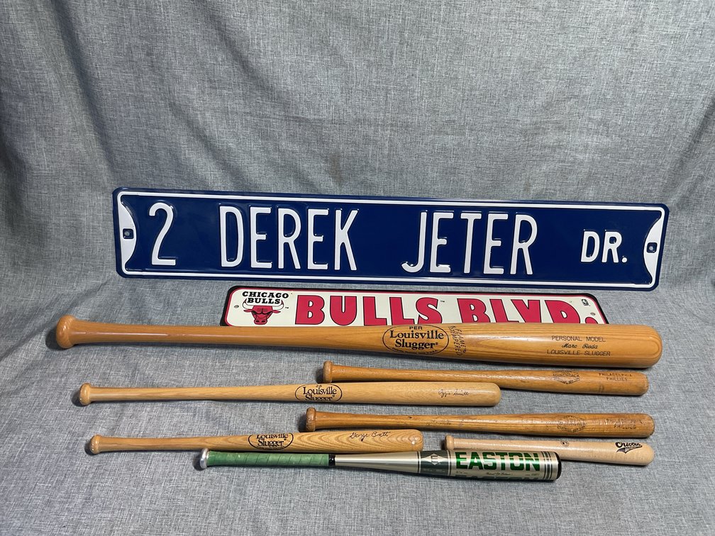 Louisville Slugger, Easton, Adirondack, and Orioles Baseball Bats with Street Signs