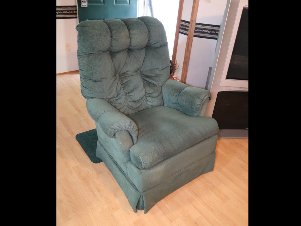 Green Upholstered Recliner, skirted base.