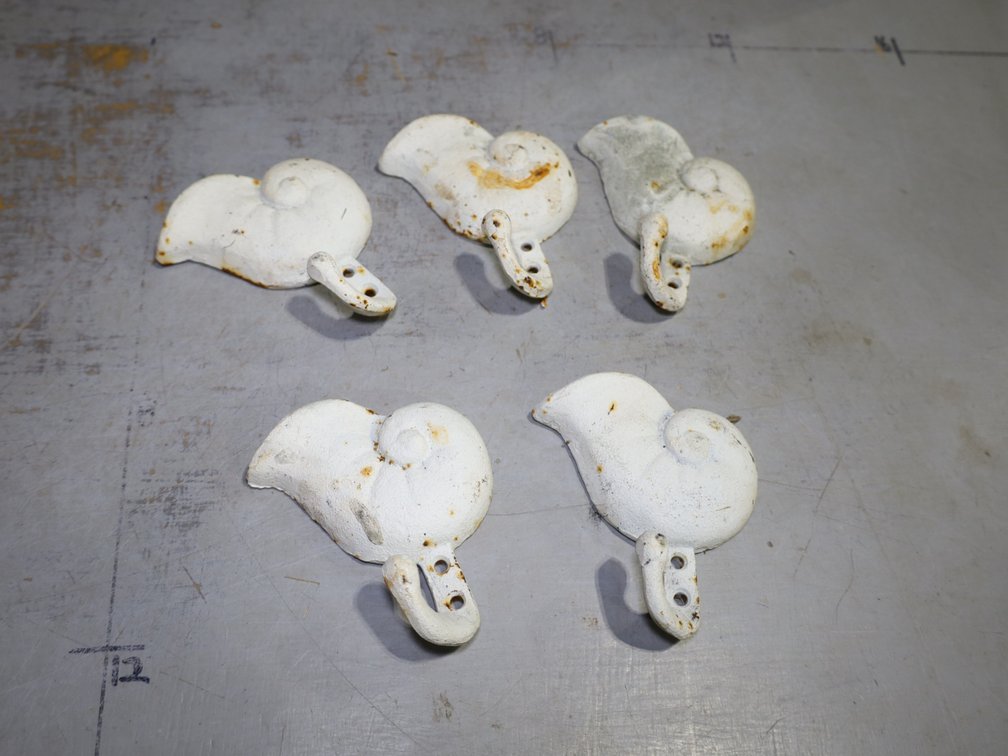 White Nautilus-Shaped Hooks, Cast Iron Star Accents, Coat Hooks, Faucet Handles & More!