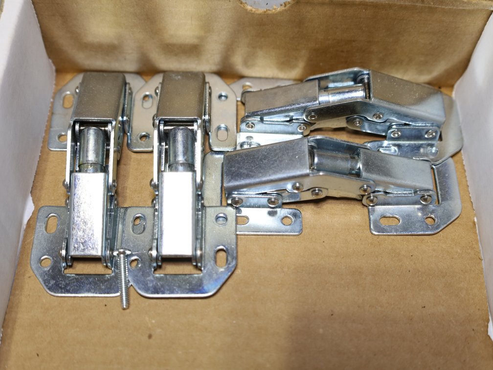 Cabinet Hinges & Container of Mounting Screws.