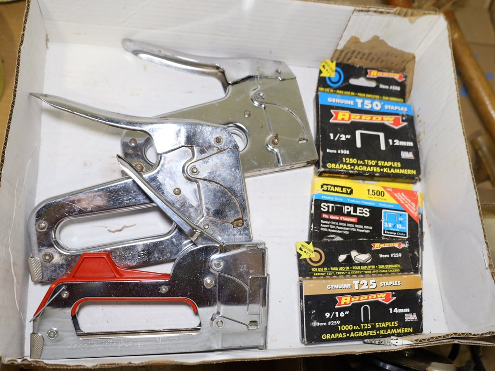 (2) Staple Guns, Boxes of Arrow T50 1/2" Staples, Stanley Heavy Duty 3/8" Staples, & Arrow T25 9/16" Staples.