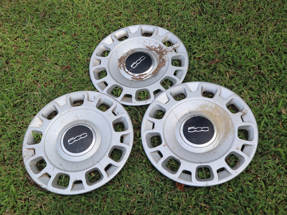 (3) Fiat 500 Hubcaps.