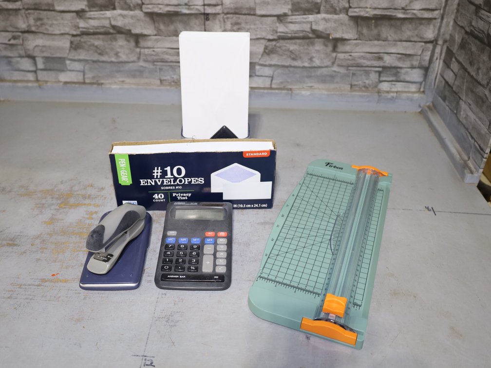 Laptop Bag, Firbon Paper Trimmer, Aurora Calculator, #10 Envelopes, Stapler, Sanford Staples...