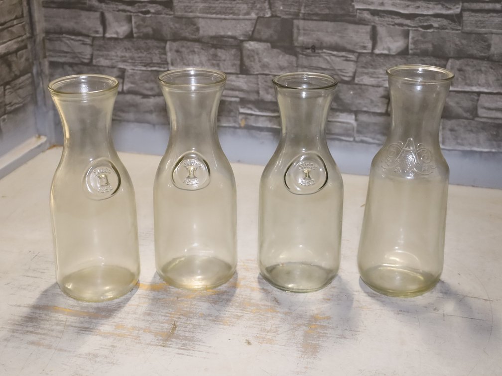 (4) Embossed Glass Carafes