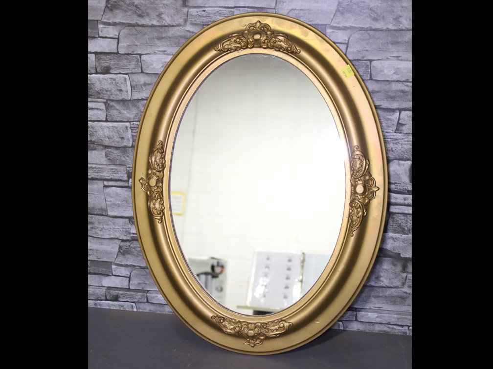 Framed oval mirror