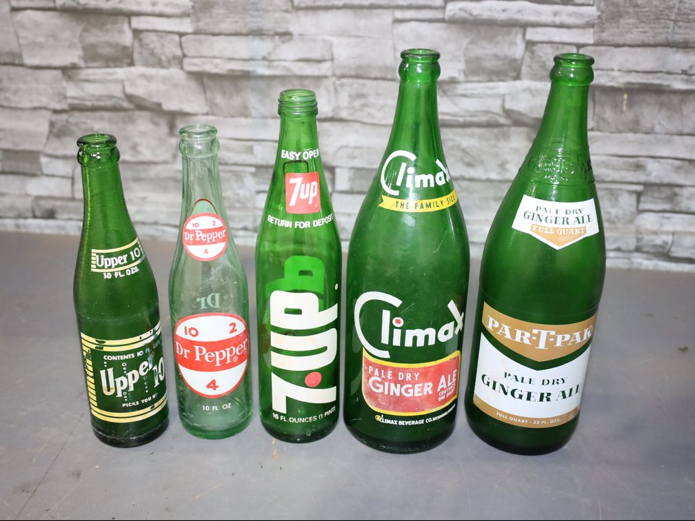 17 vintage soda bottles