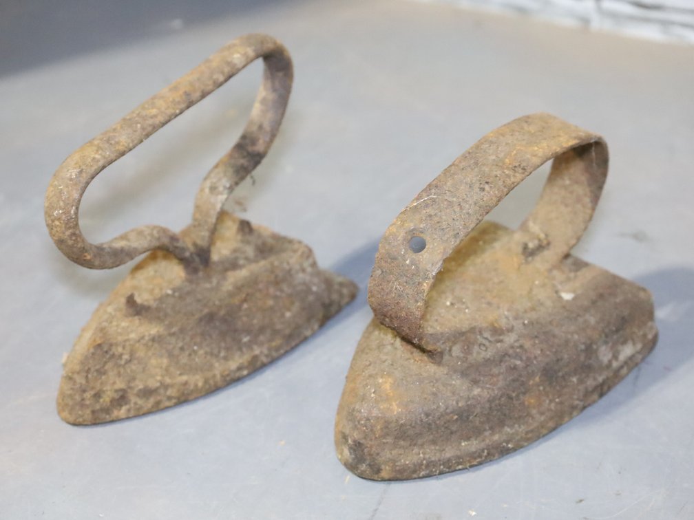4  antique sad irons - 2 without handles 