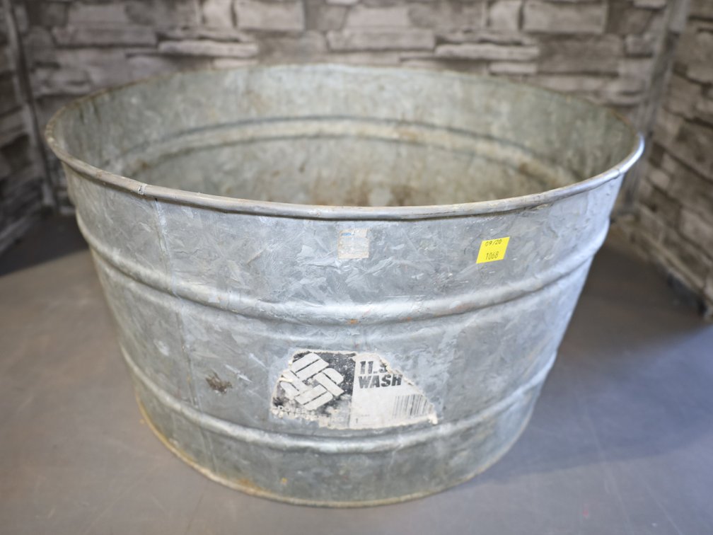 Galvanized tub and 5-gallon bucket with cast-iron shoe forms
