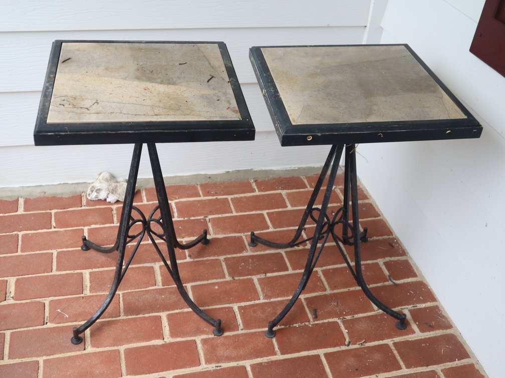 2 matching wrought iron stands with tile tops