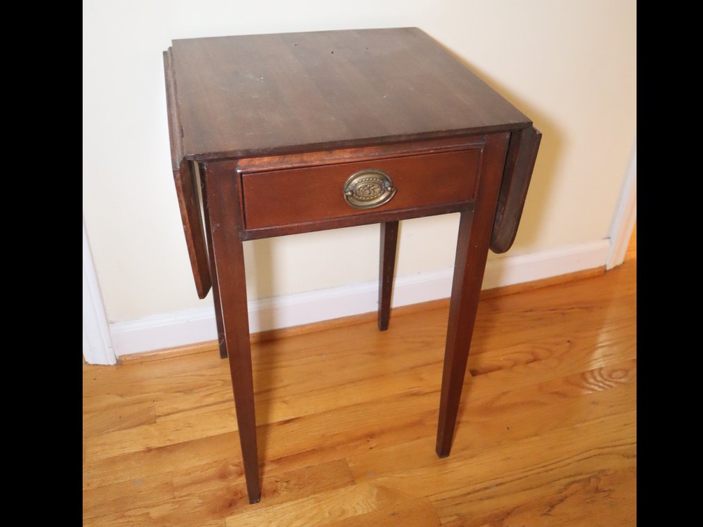 Wooden drop-leaf accent table with drawer