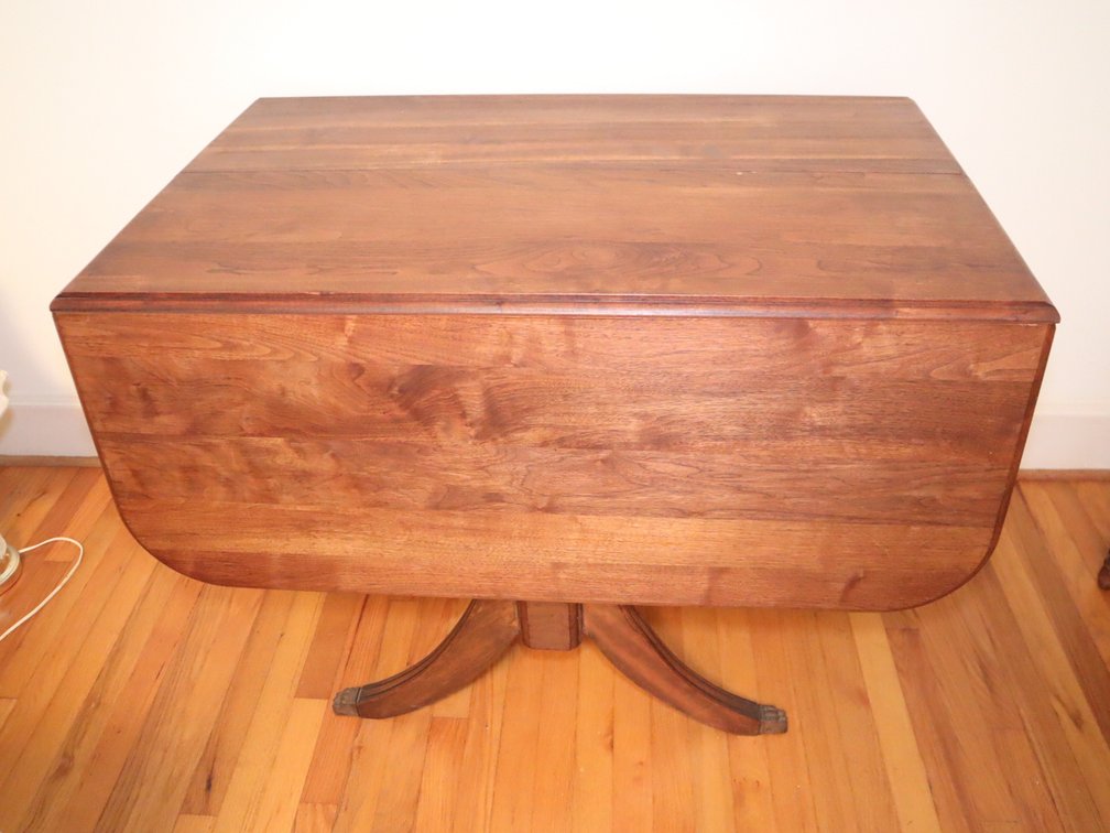 Walnut drop-leaf dining table with 2 additional 8" leaves