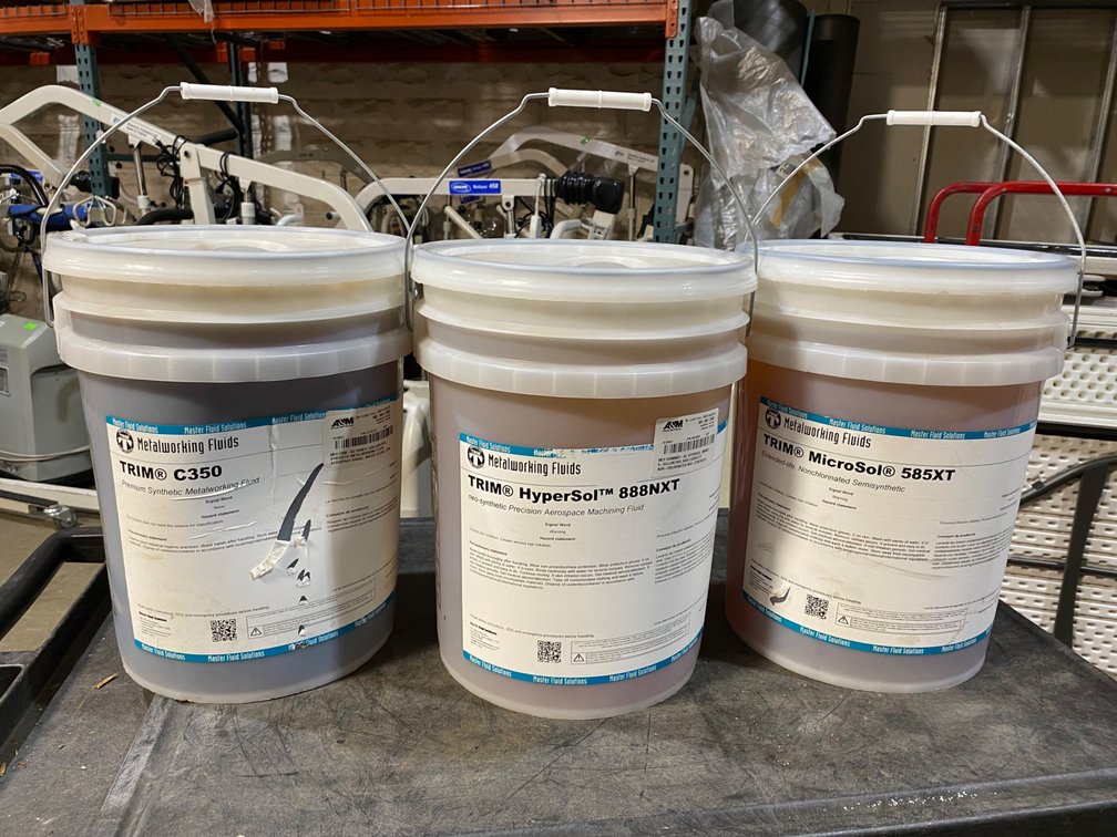 A Group of TRIM Metalworking Fluids, 5GAL