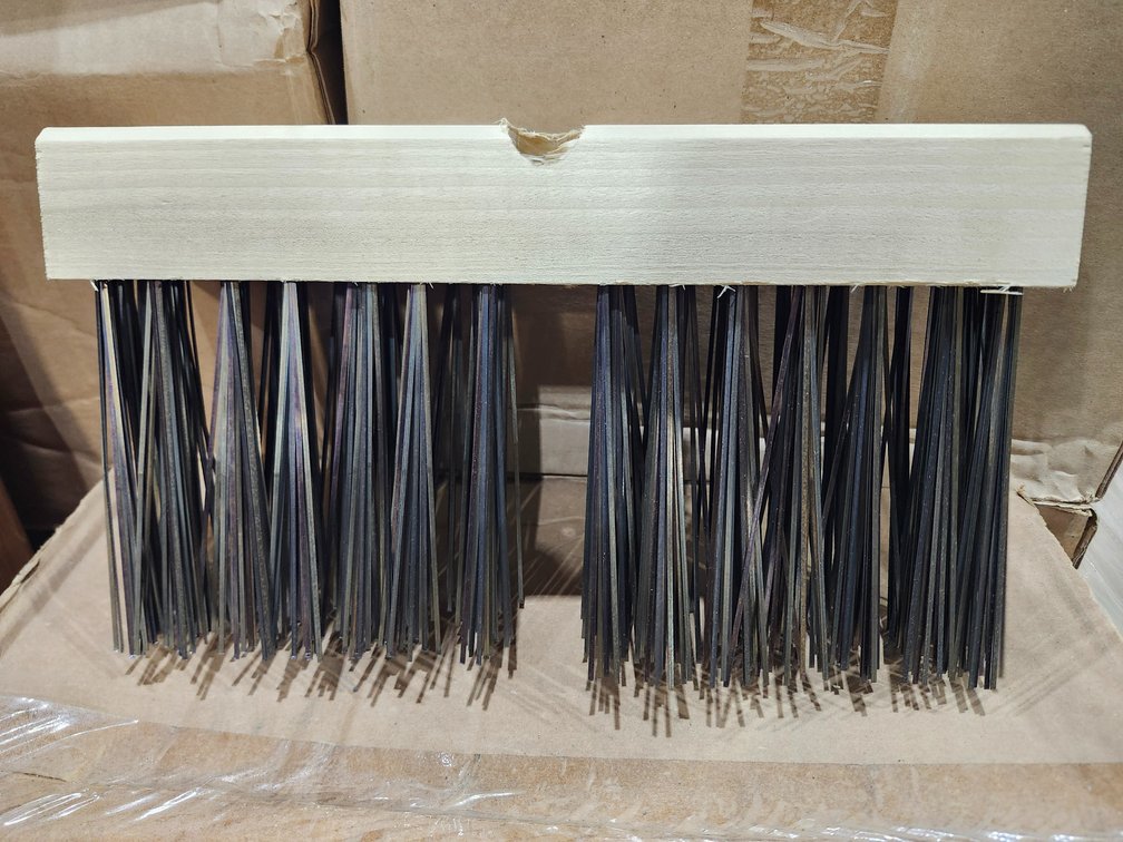 A Group of Wire Broom Heads and Handles